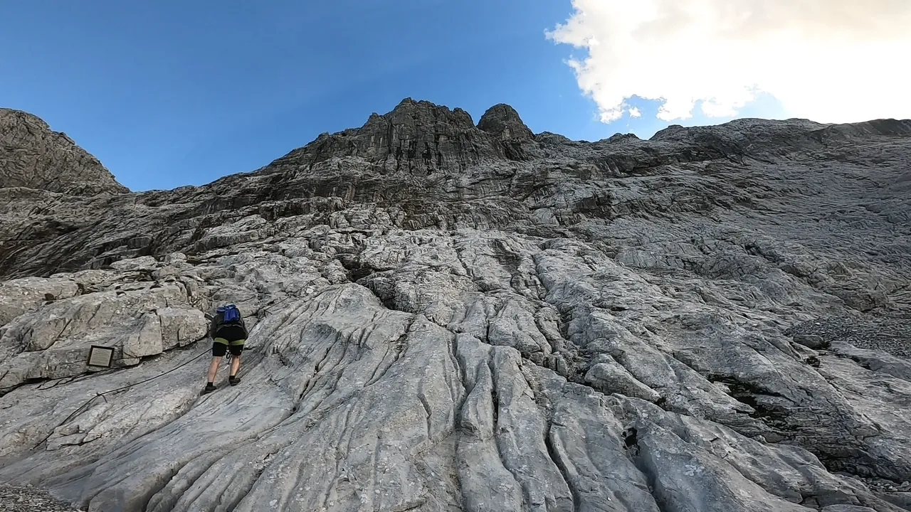This is where the actual climbing began after a long hike through rugged landscapes.