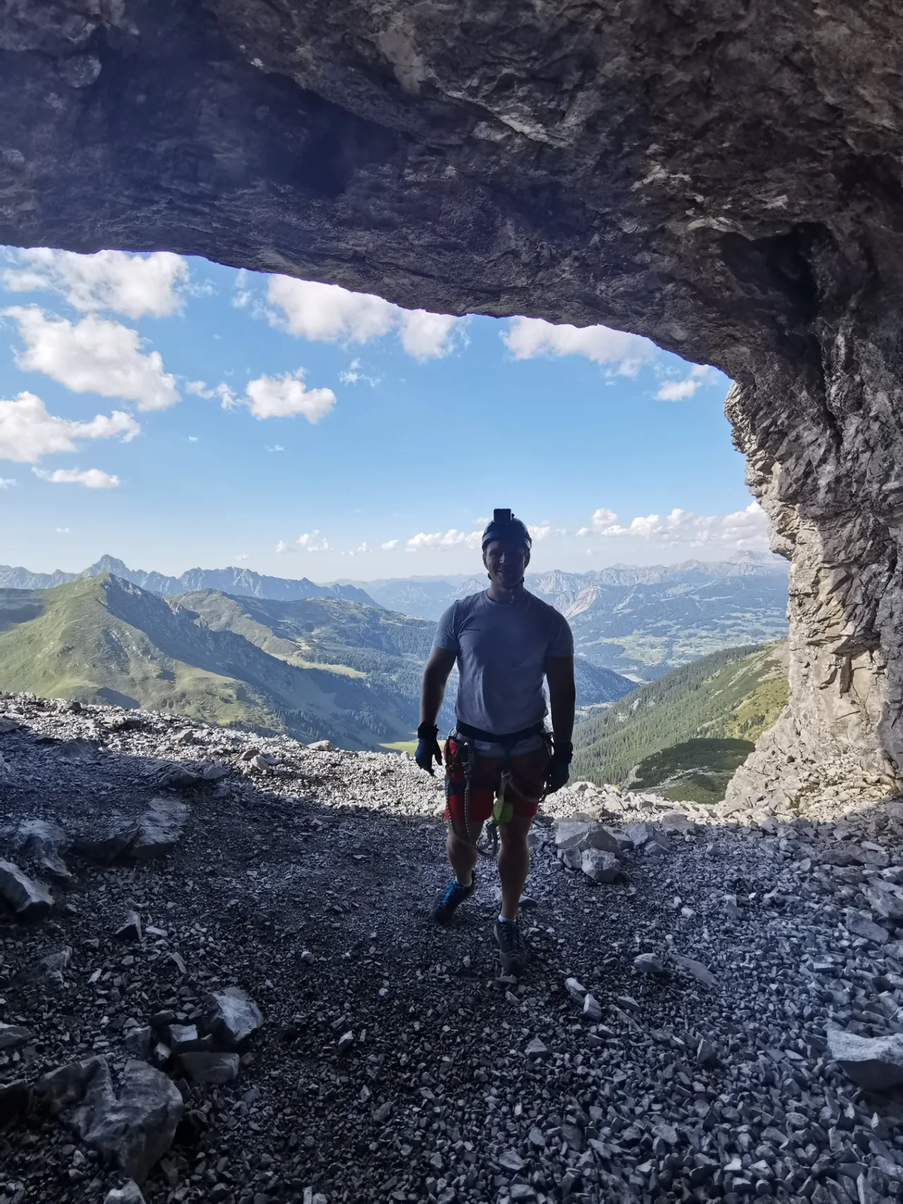 The route led through a cave in the middle of a vertical wall, which was traversed to another opening.