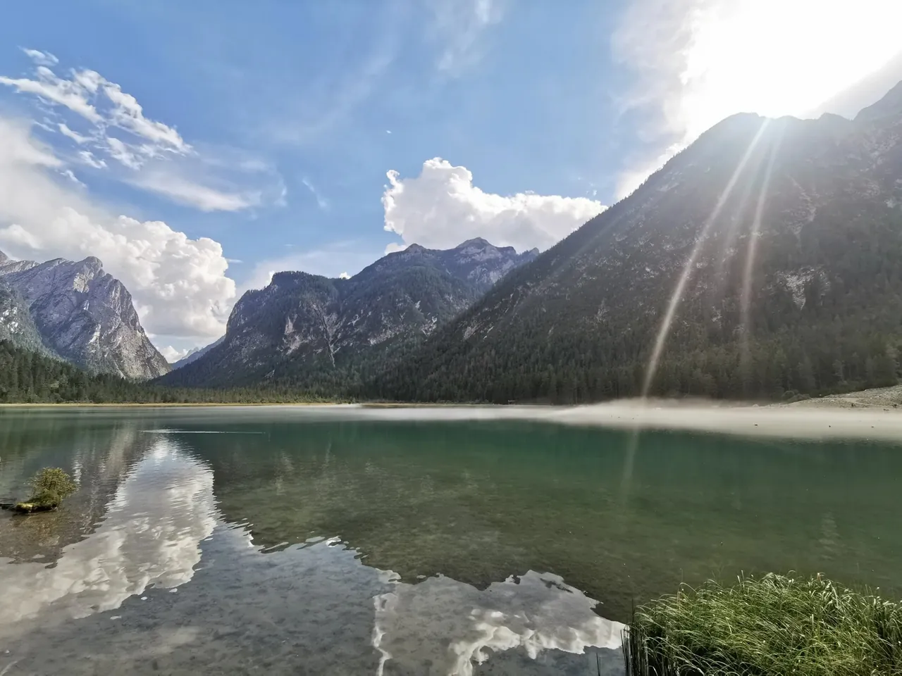 Lago di Dobbiaco, Italy. A beautiful fog hovered over the lake, and the scenery was impressive. The water was cold and the bottom muddy.